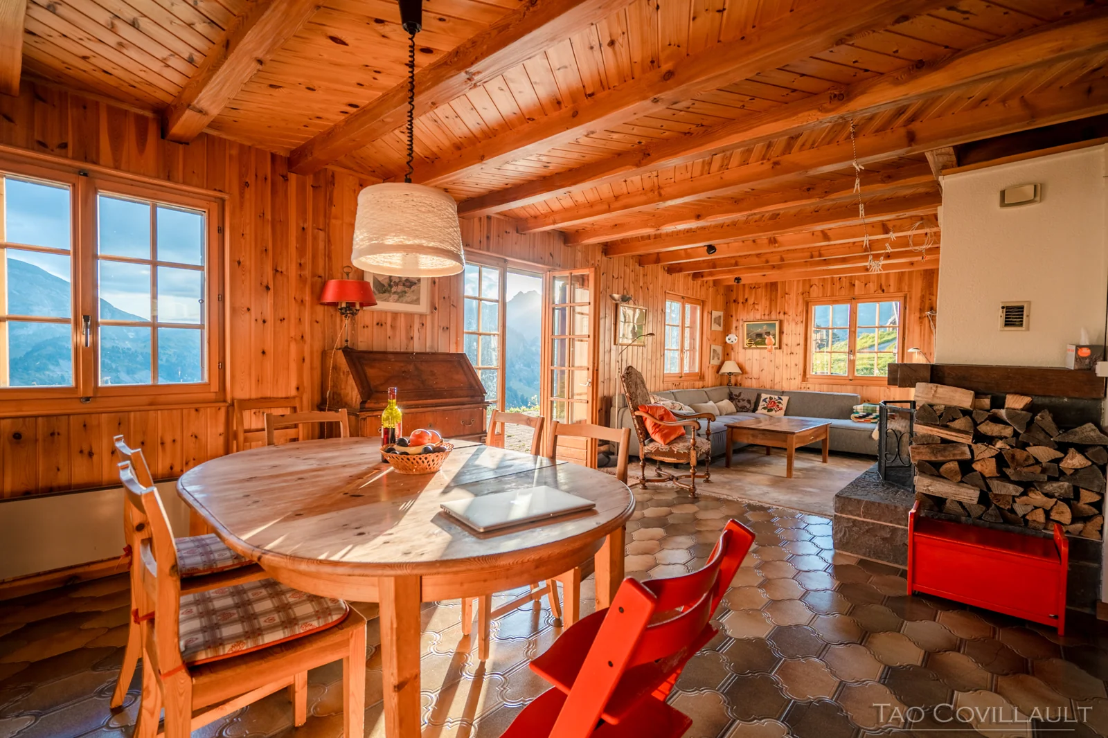 Wood-panelled chalet dining and sitting room.