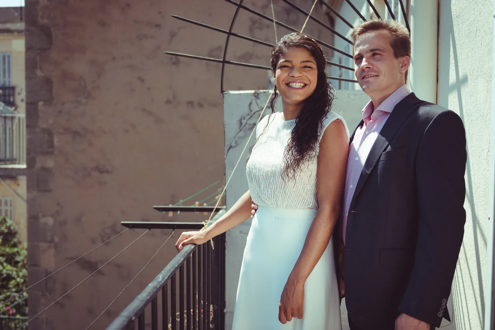 Couple posing together on a stairway.