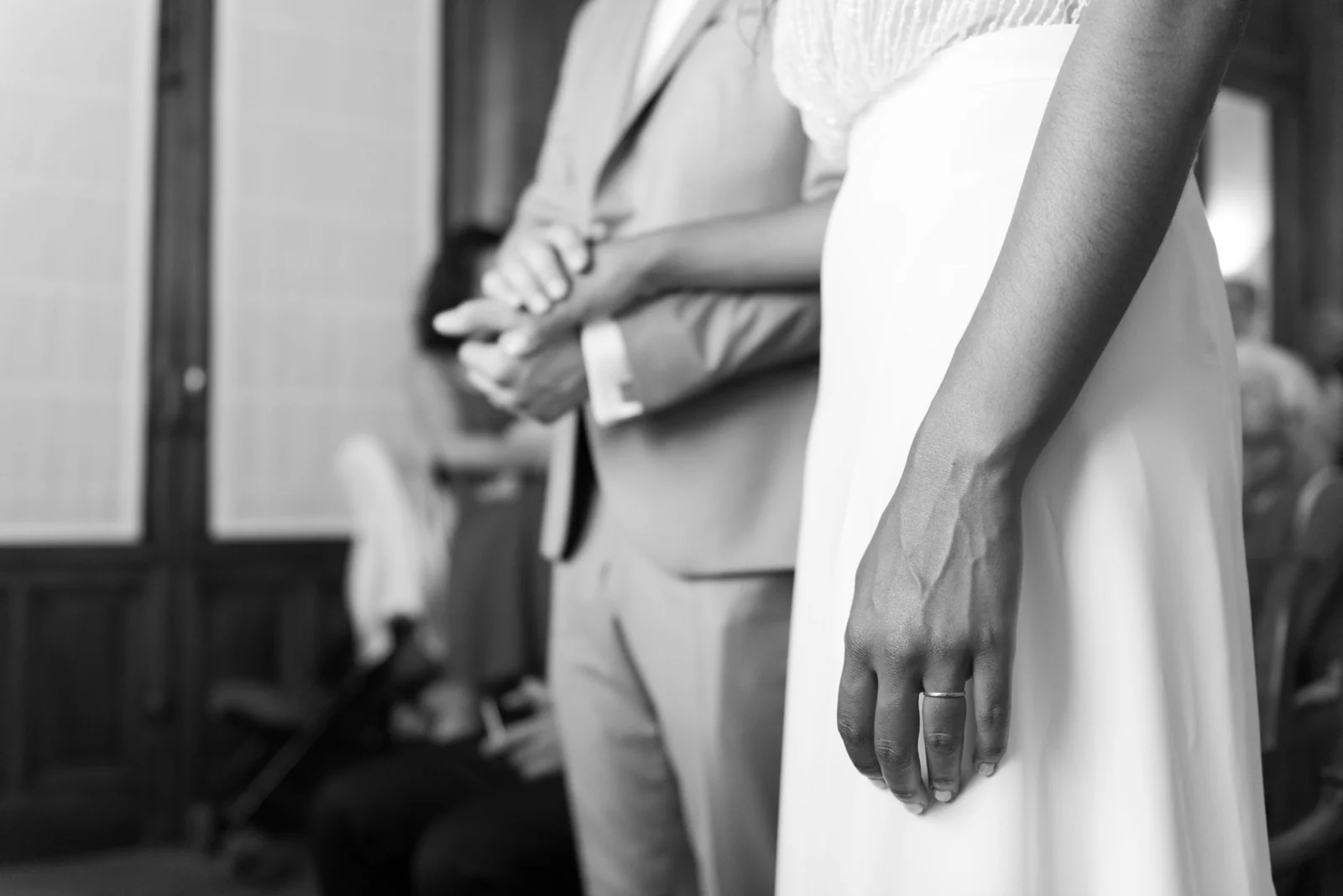 Black-and-white detail of the couple standing together.