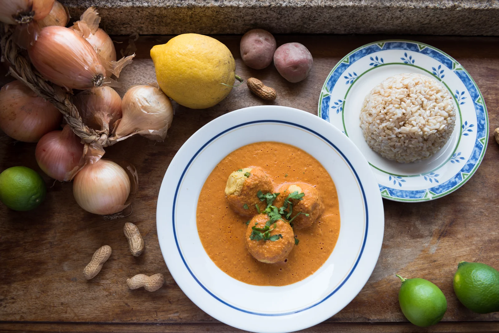 Overhead view of a plated meal with rice and fresh ingredients.